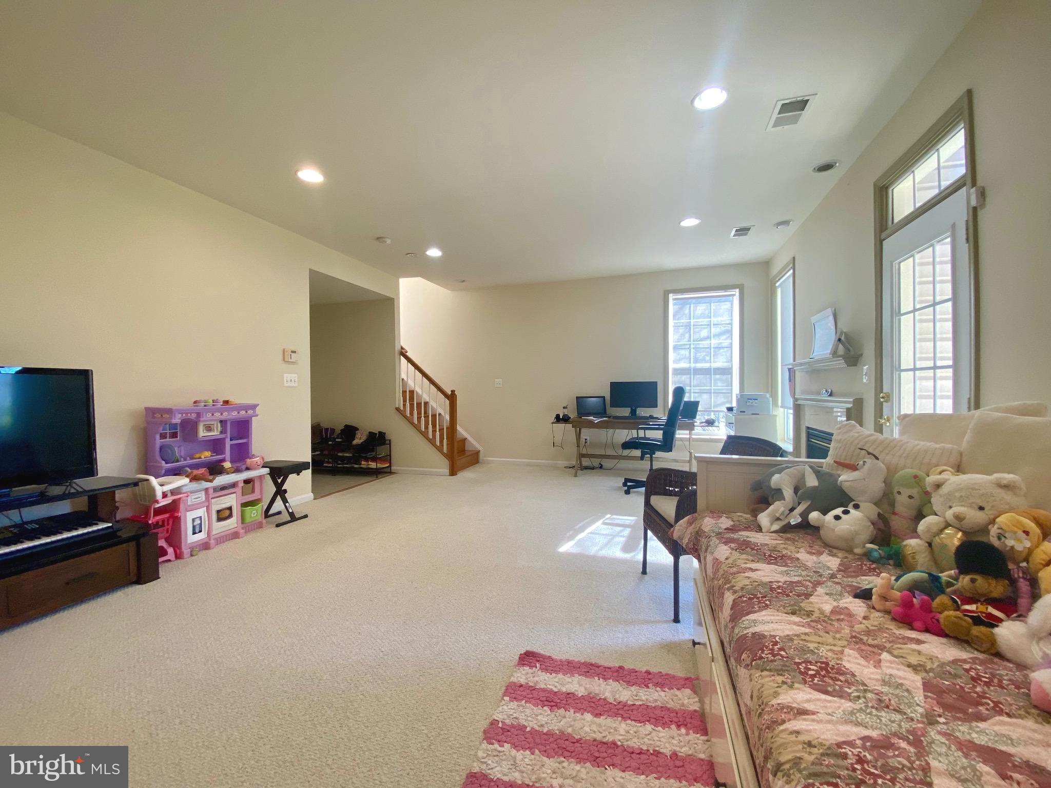 21975 Windover Drive Broadlands, VA 20148 - Photo 26 of 37 a living room with furniture and a flat screen tv