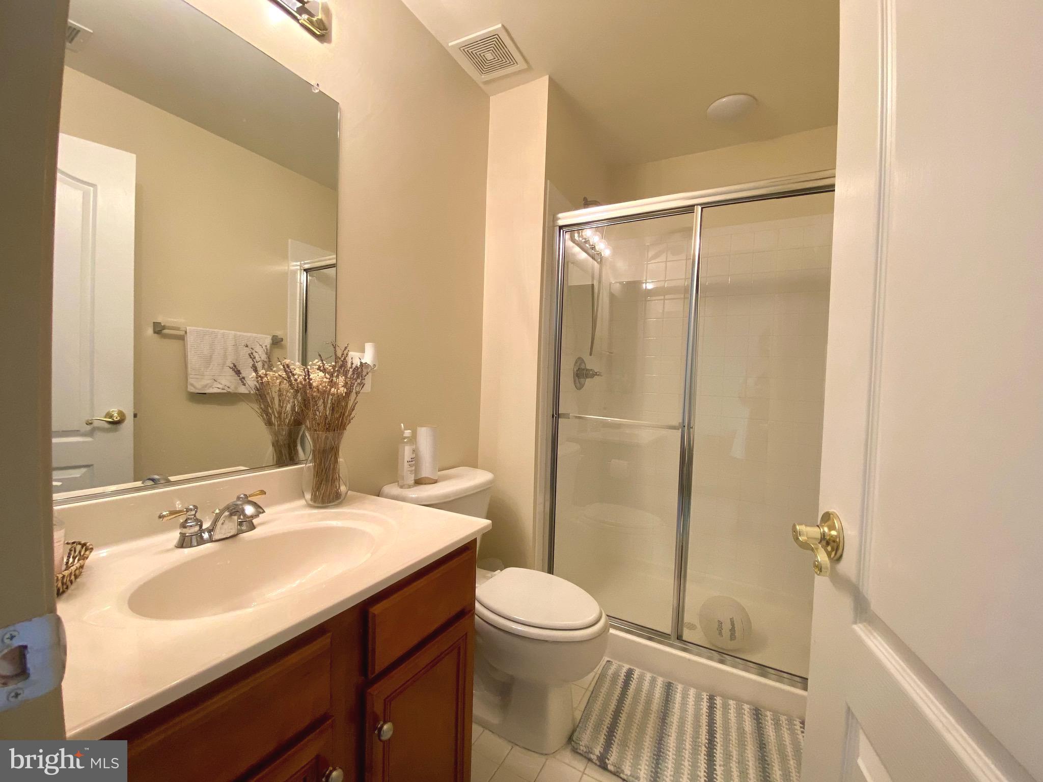 21975 Windover Drive Broadlands, VA 20148 - Photo 28 of 37 a bathroom with a sink toilet and shower