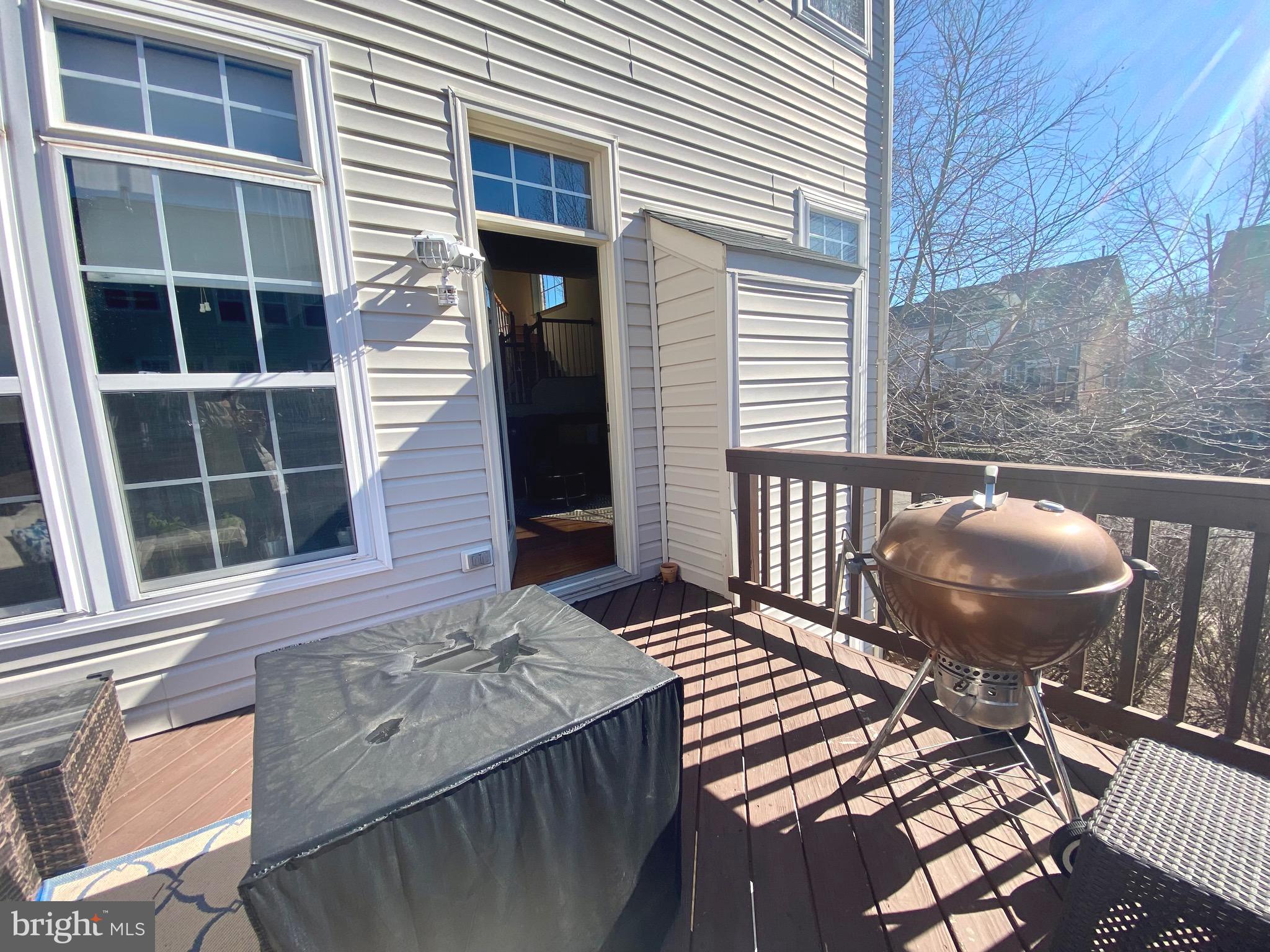 21975 Windover Drive Broadlands, VA 20148 - Photo 30 of 37 a view of a balcony with chair and wooden floor