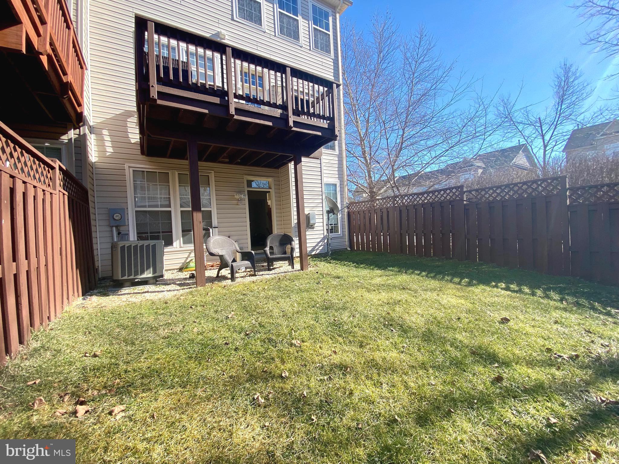 21975 Windover Drive Broadlands, VA 20148 - Photo 32 of 37 a view of a backyard with a small cabin and furniture