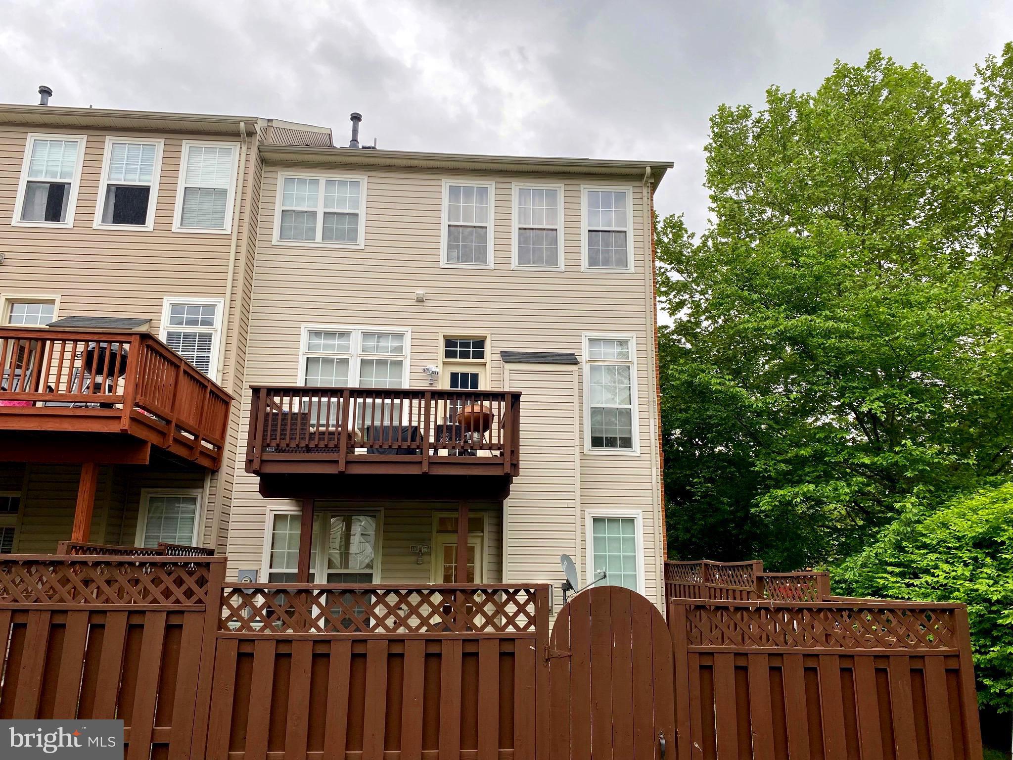21975 Windover Drive Broadlands, VA 20148 - Photo 35 of 37 a view of a house with wooden deck and furniture