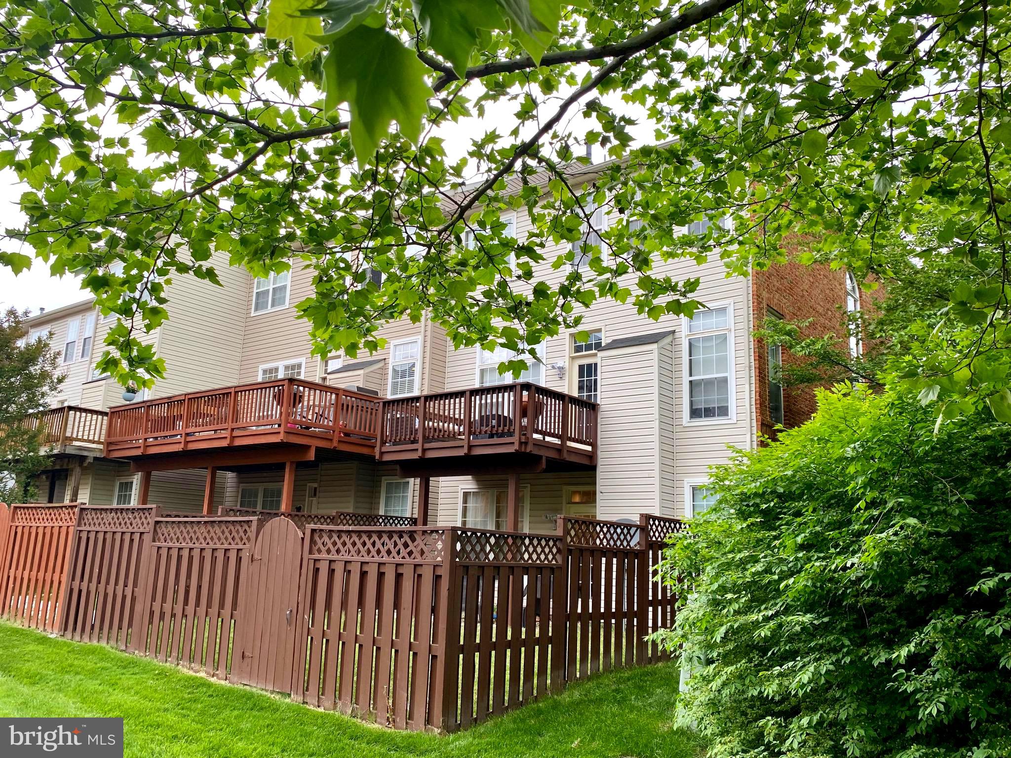 21975 Windover Drive Broadlands, VA 20148 - Photo 36 of 37 a view of a house with a deck and backyard
