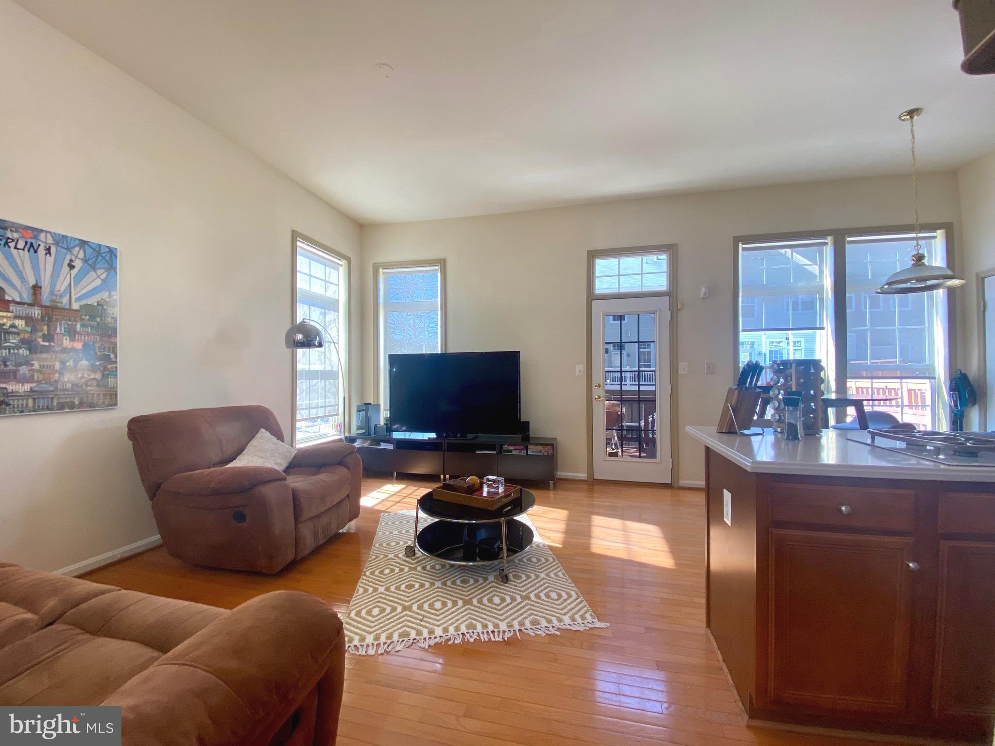 21975 Windover Drive Broadlands, VA 20148 - Photo 10 of 37 a living room with furniture and a flat screen tv