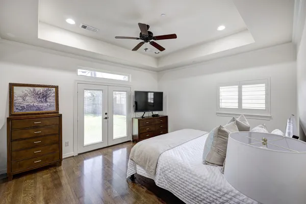 a bedroom with a bed and a tv