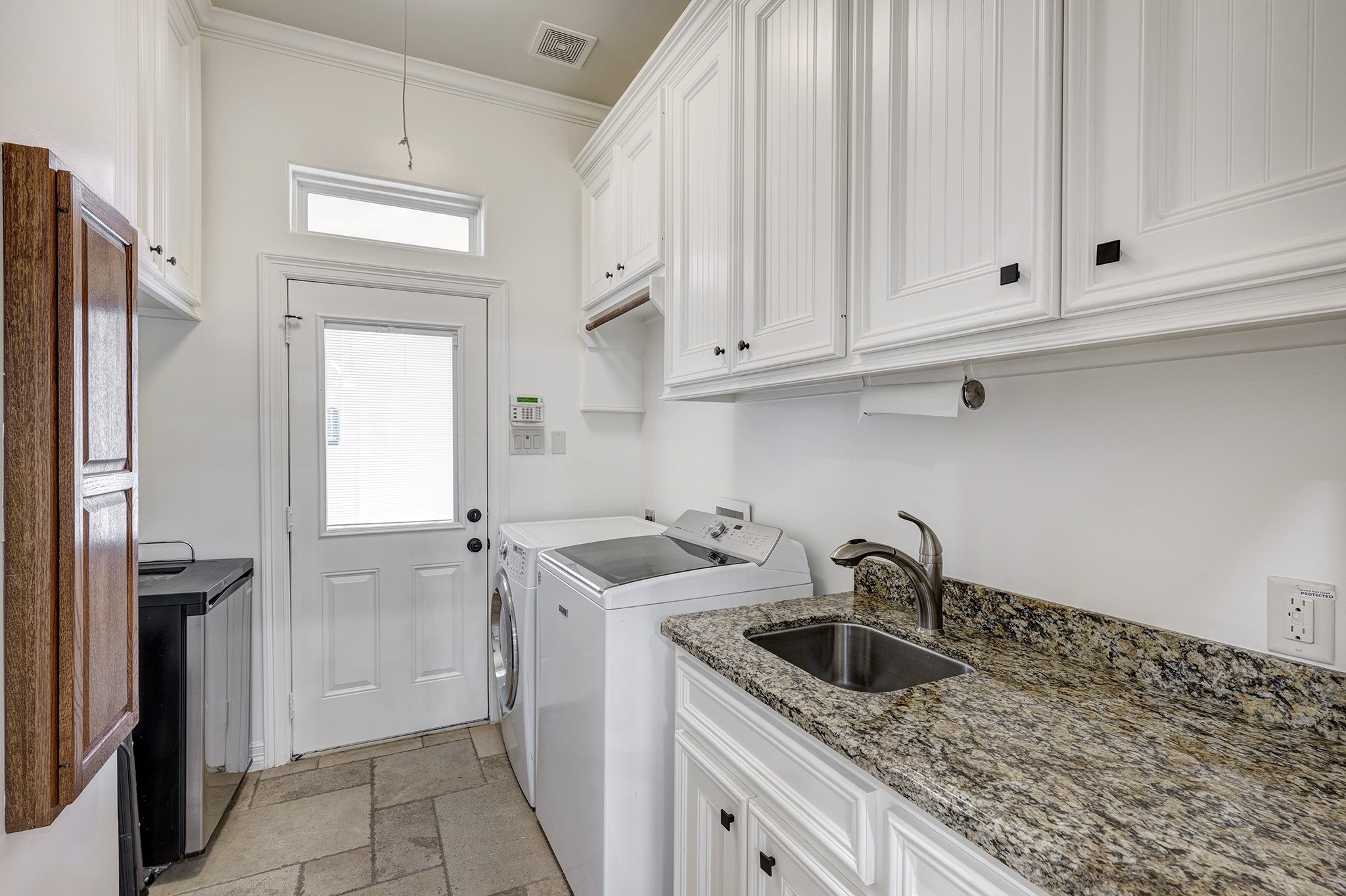 1324 Bingle Road Spring Valley Village, TX 77055 - Photo 18 of 22 a kitchen with white cabinets and a sink
