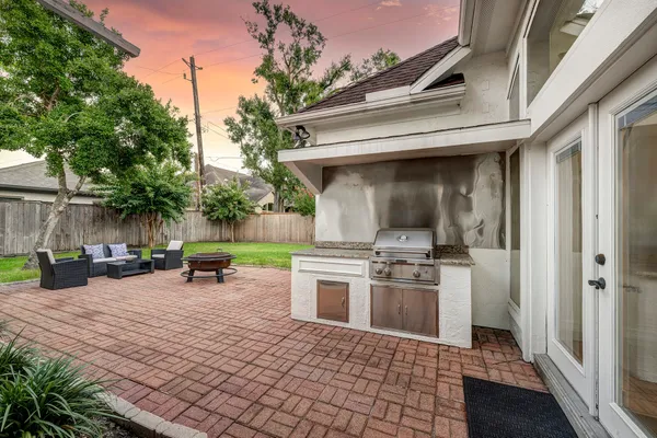 a view of a patio with a table and chairs in a patio