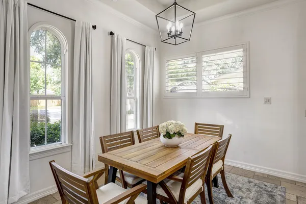 a view of a dining room with furniture window and outside view