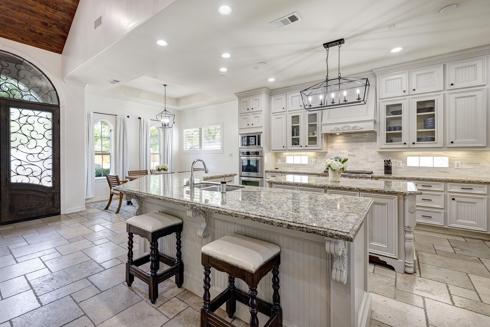 1324 Bingle Road Spring Valley Village, TX 77055 - Photo 7 of 22 a kitchen with center island table and chairs in it