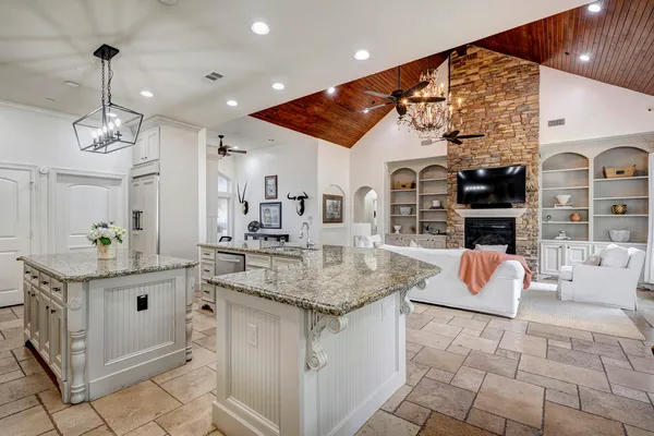 a view of living room with granite countertop furniture and fireplace