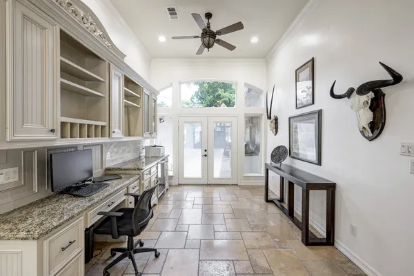 a view of a kitchen with furniture and a ceiling fan