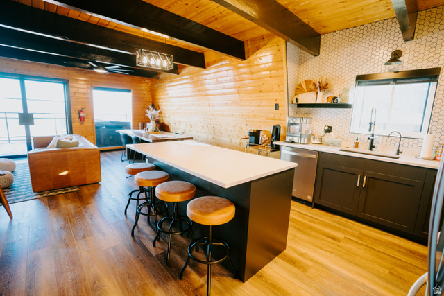 1413 Basel Drive Midway, UT 84049 - Photo 137 of 137 Kitchen featuring healthy amount of natural light, a wood ceiling with exposed beams, a center island, light wood-type flooring, and open floor plan