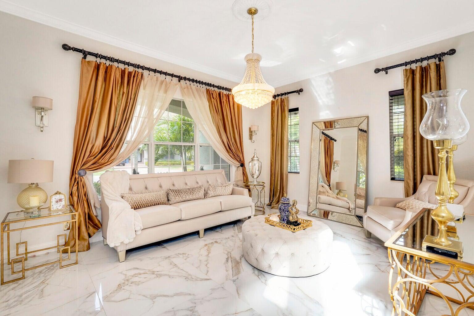 599 Cresta Circle West Palm Beach, FL 33413 - Photo 11 of 56 a living room with furniture and a large window