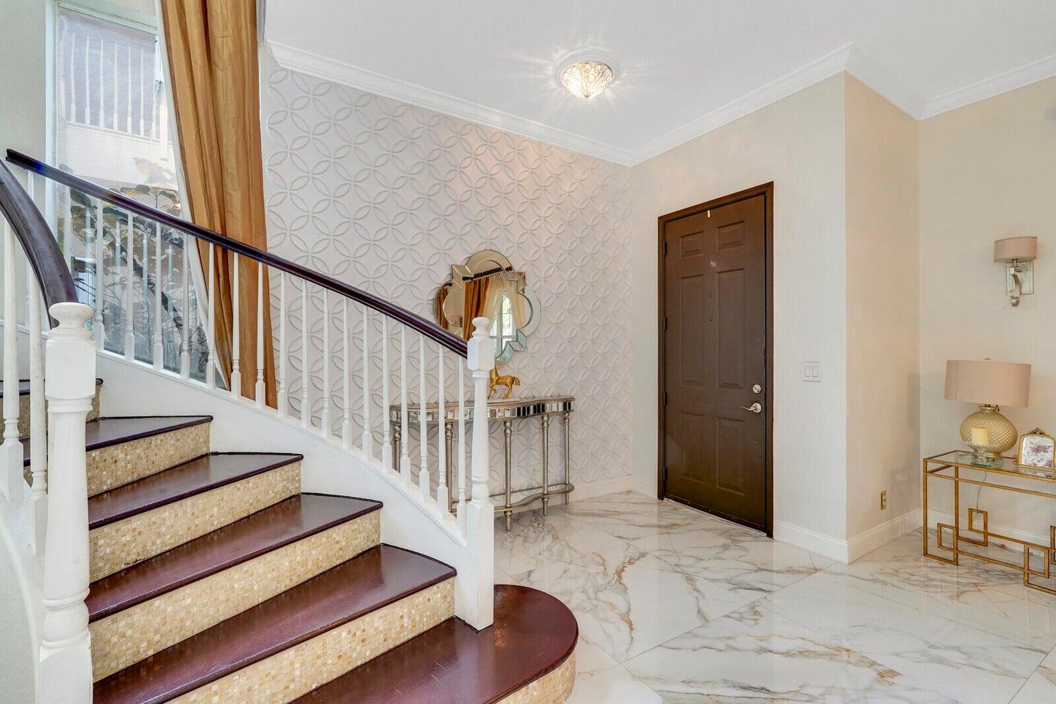 599 Cresta Circle West Palm Beach, FL 33413 - Photo 12 of 56 a view of entryway and hall with wooden floor