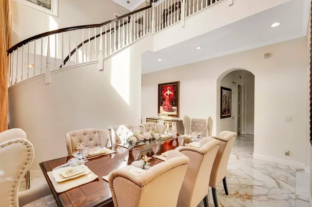 a dining room with furniture and window