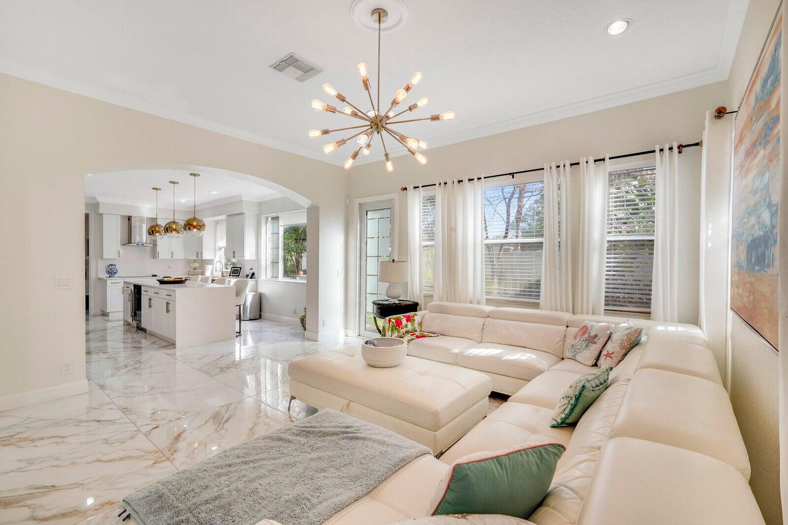 599 Cresta Circle West Palm Beach, FL 33413 - Photo 15 of 56 a living room with furniture and large windows