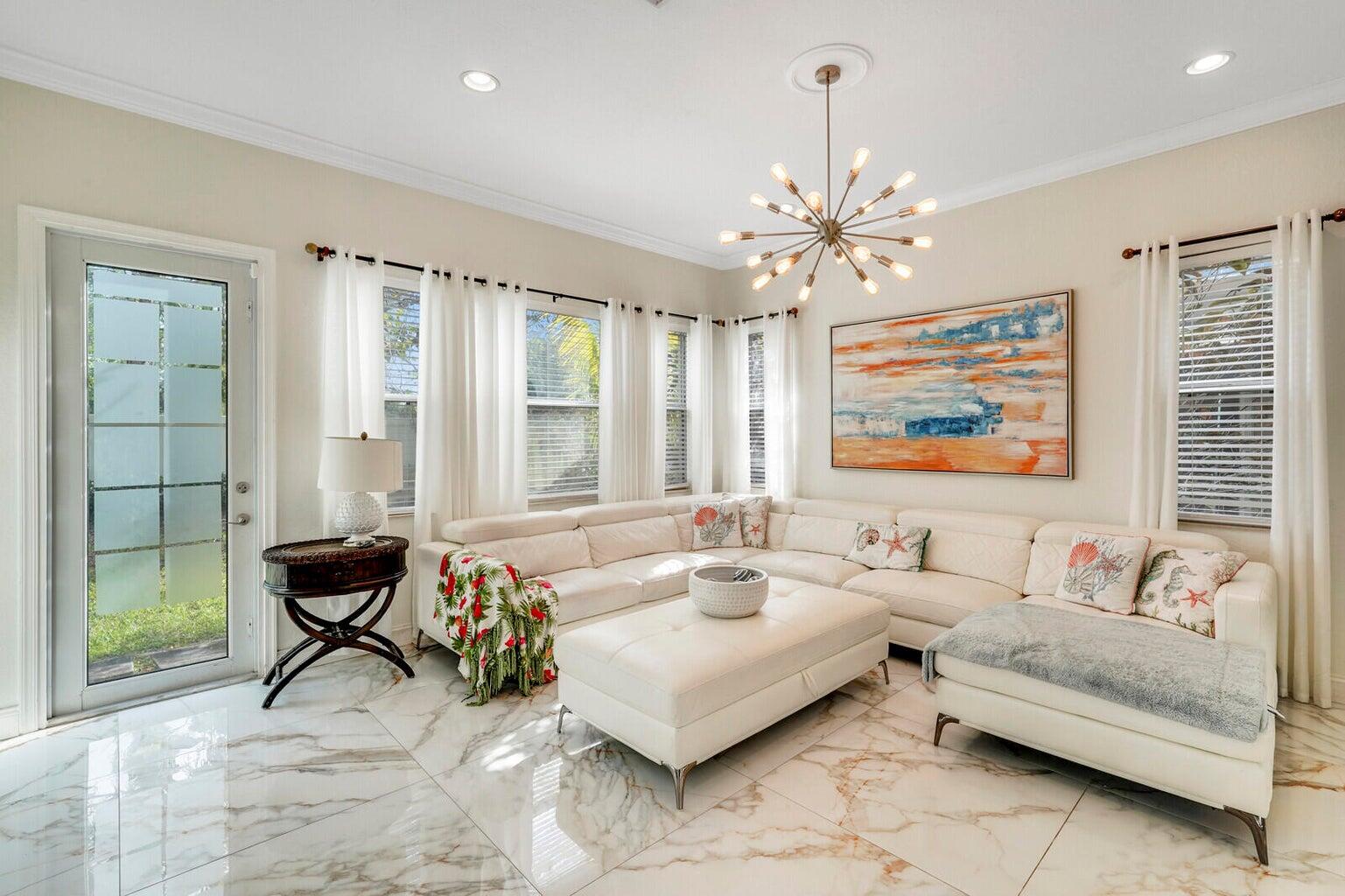 599 Cresta Circle West Palm Beach, FL 33413 - Photo 17 of 56 a living room with furniture and a chandelier