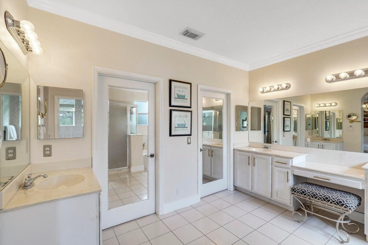 599 Cresta Circle West Palm Beach, FL 33413 - Photo 30 of 56 a large bathroom with a tub sink shower and mirror