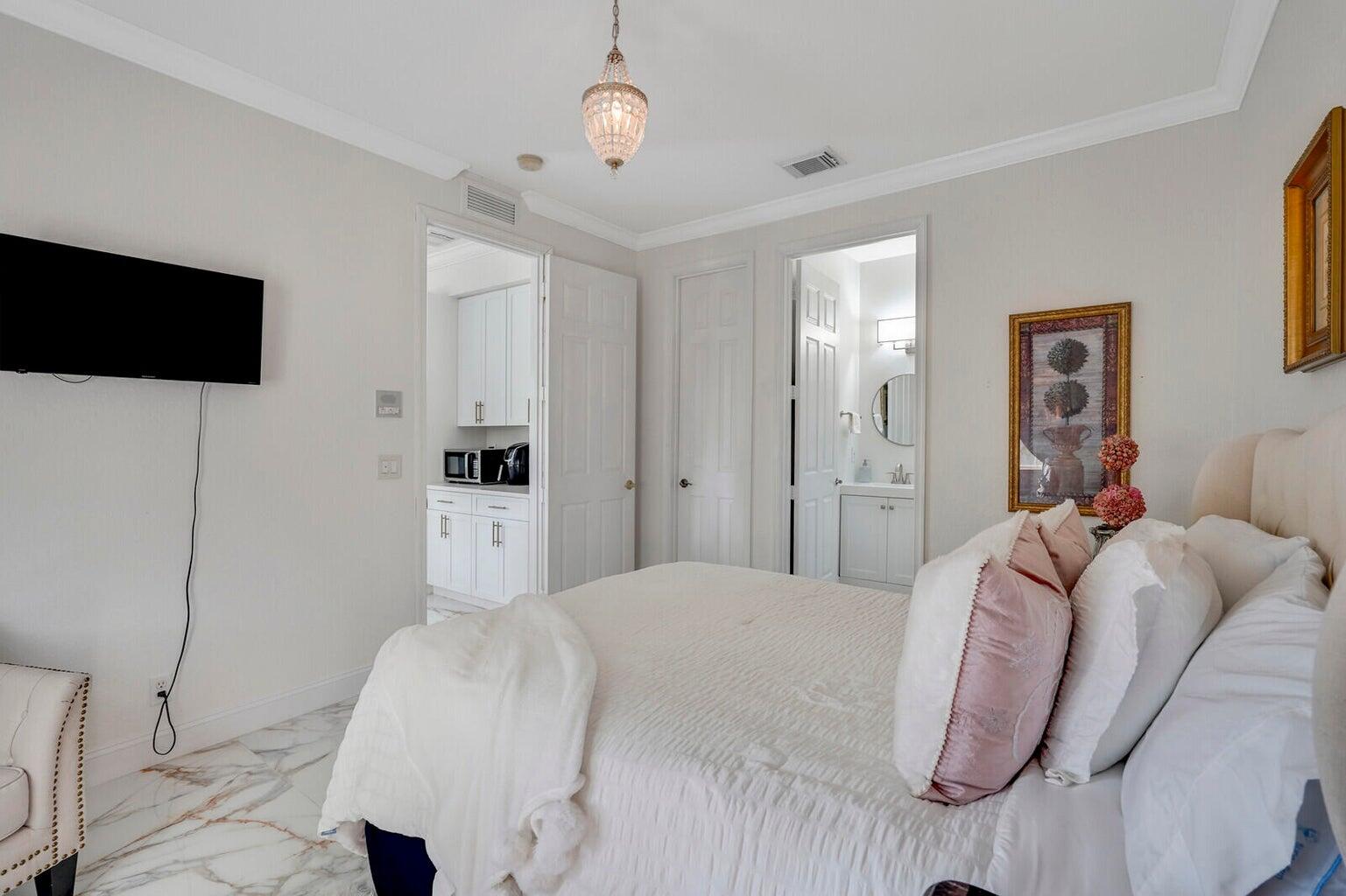 599 Cresta Circle West Palm Beach, FL 33413 - Photo 32 of 56 a bedroom with a bed and a television