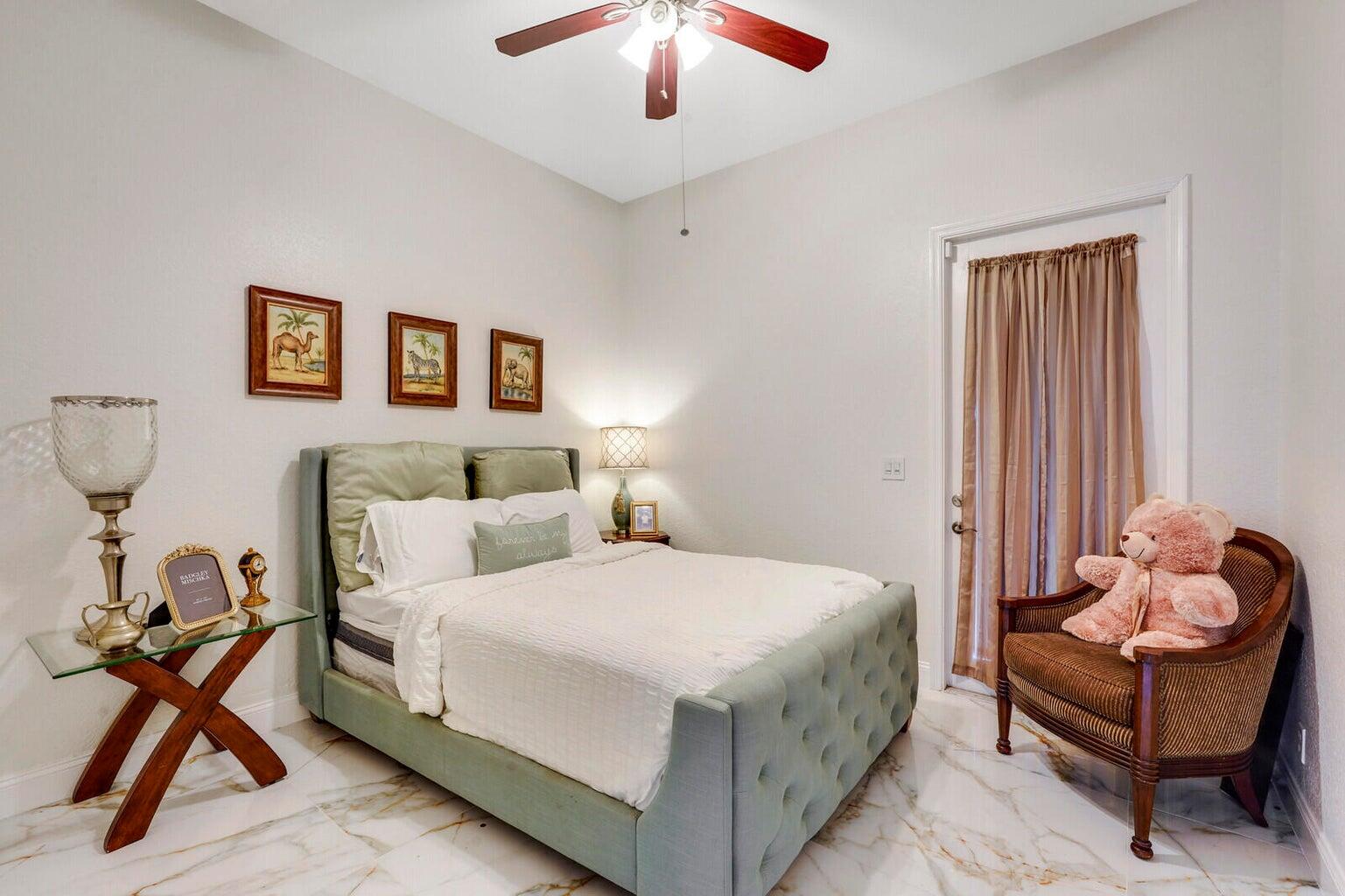 599 Cresta Circle West Palm Beach, FL 33413 - Photo 34 of 56 a bedroom with a bed and window