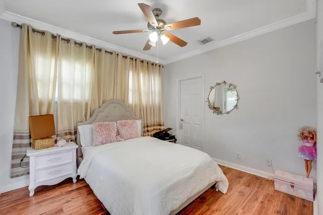 a bathroom with double vanity sinks a vanity a lamp and a mirror