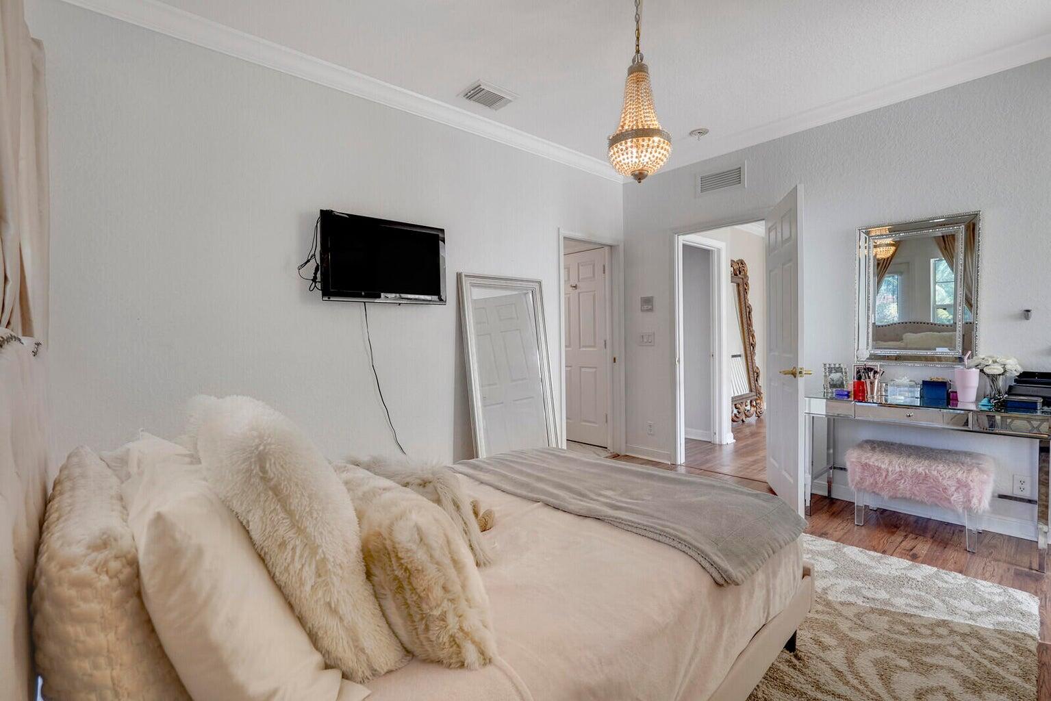 599 Cresta Circle West Palm Beach, FL 33413 - Photo 41 of 56 a bedroom with a bed and a flat screen tv