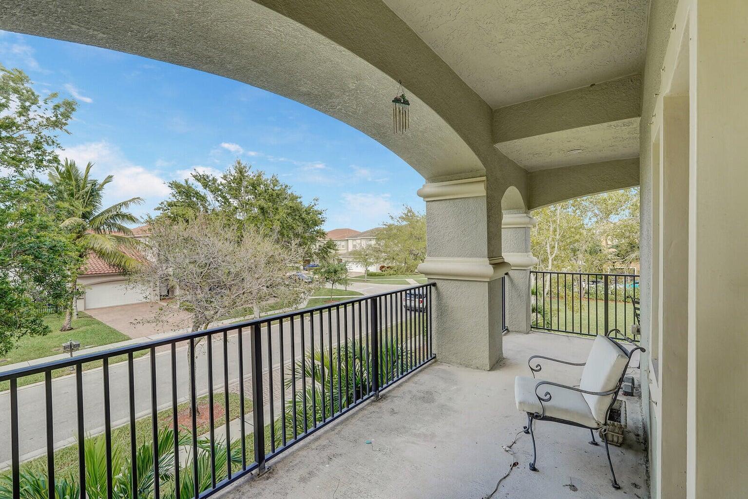 599 Cresta Circle West Palm Beach, FL 33413 - Photo 43 of 56 a balcony with wooden floor