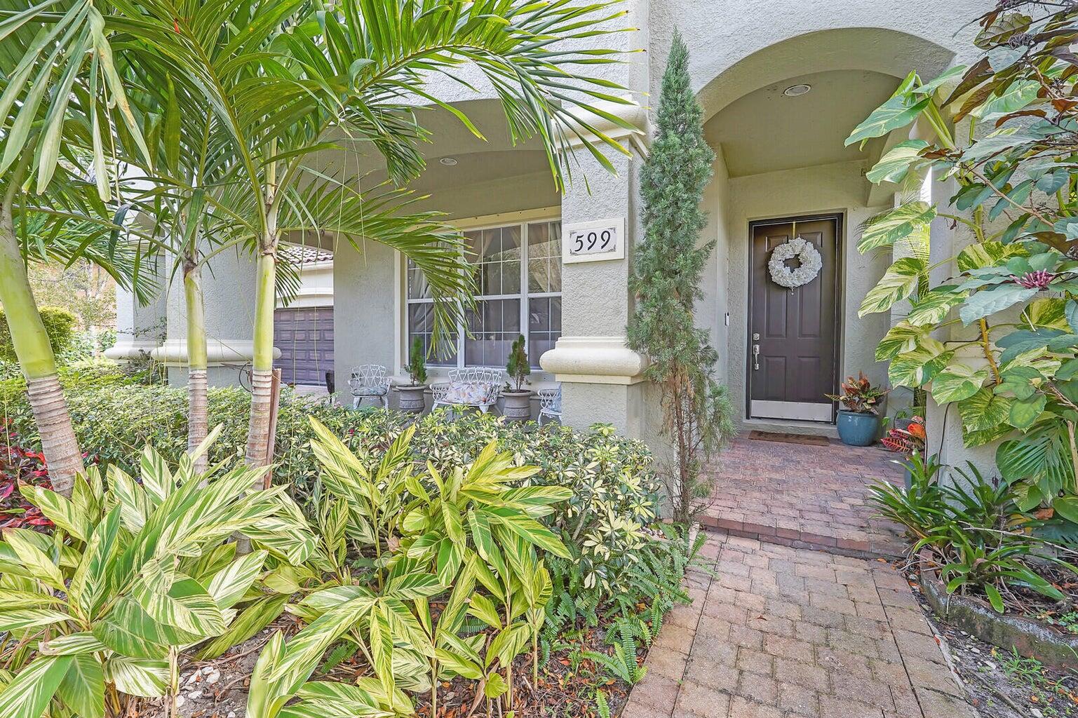 599 Cresta Circle West Palm Beach, FL 33413 - Photo 46 of 56 a front view of a house with a garden