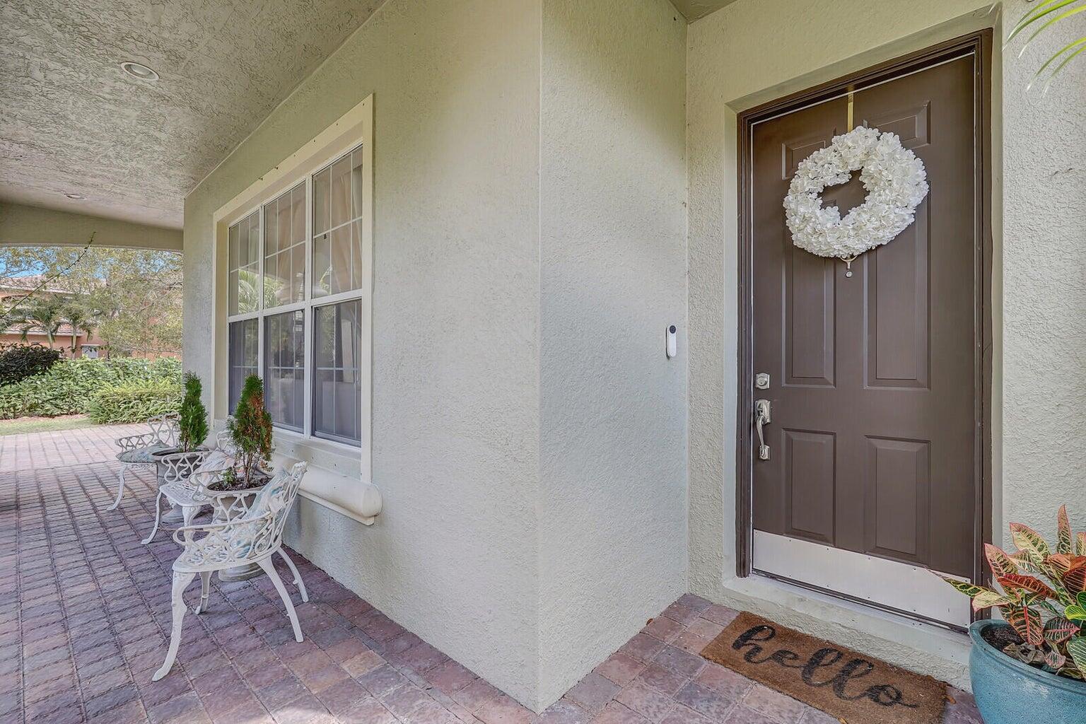 599 Cresta Circle West Palm Beach, FL 33413 - Photo 47 of 56 a view of an entryway with wooden floor
