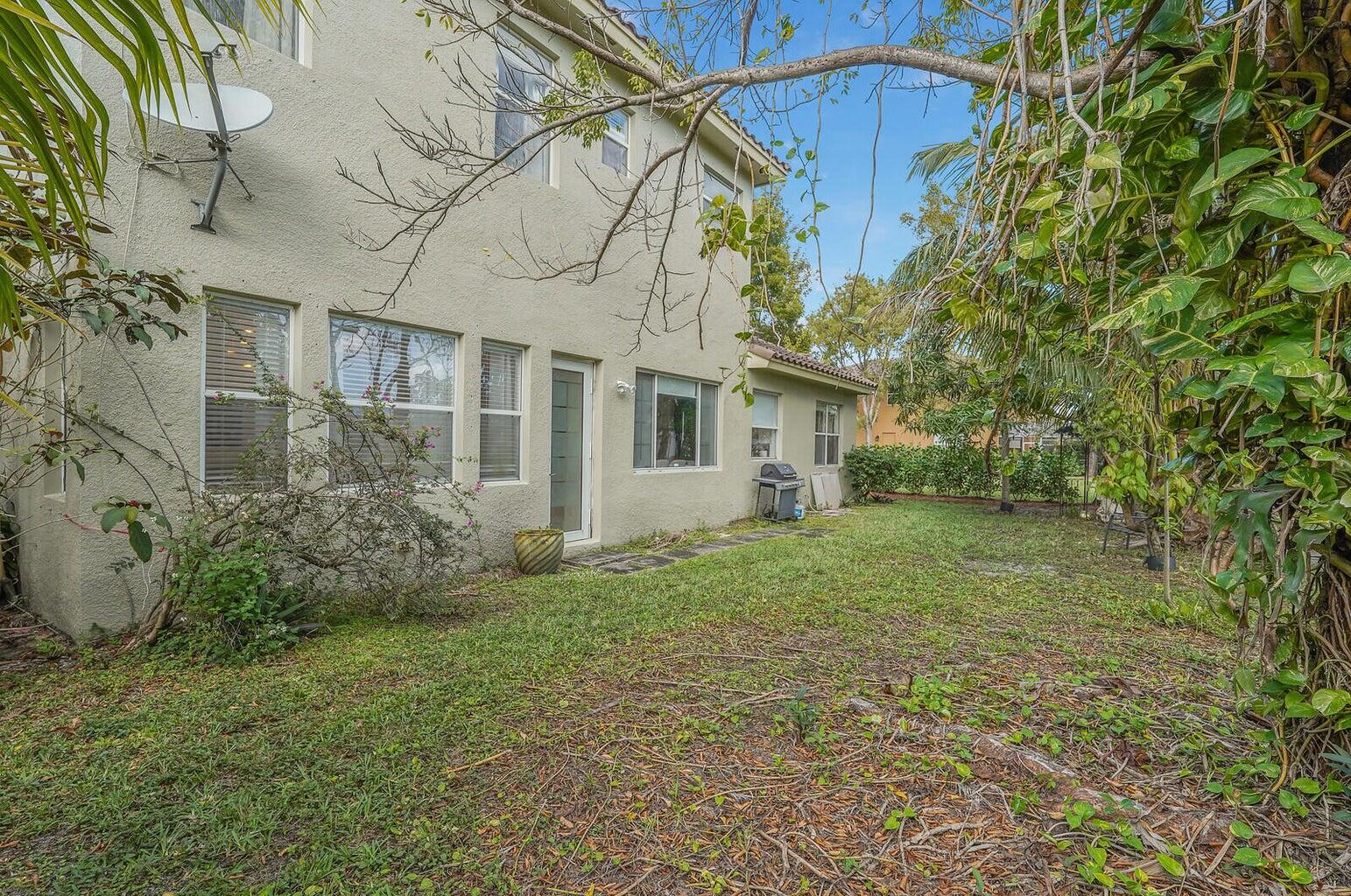 599 Cresta Circle West Palm Beach, FL 33413 - Photo 49 of 56 a view of a house with a back yard