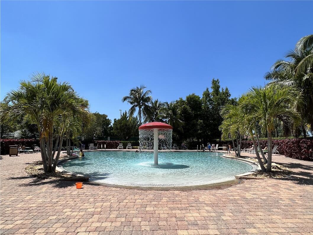 599 Cresta Circle West Palm Beach, FL 33413 - Photo 51 of 56 a swimming pool with outdoor seating and yard