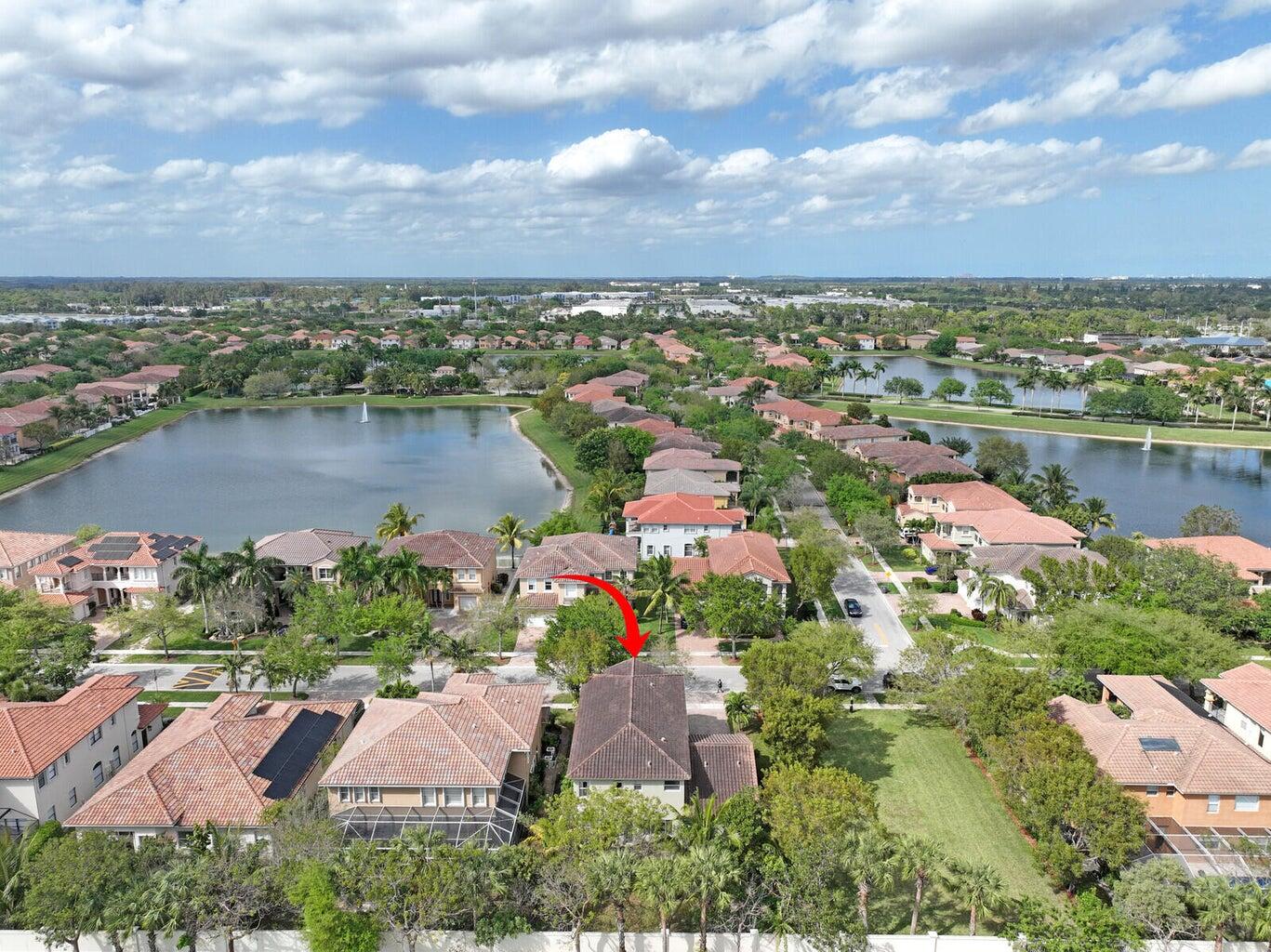 599 Cresta Circle West Palm Beach, FL 33413 - Photo 6 of 56 an aerial view of lake and residential houses with outdoor space and lake view in back