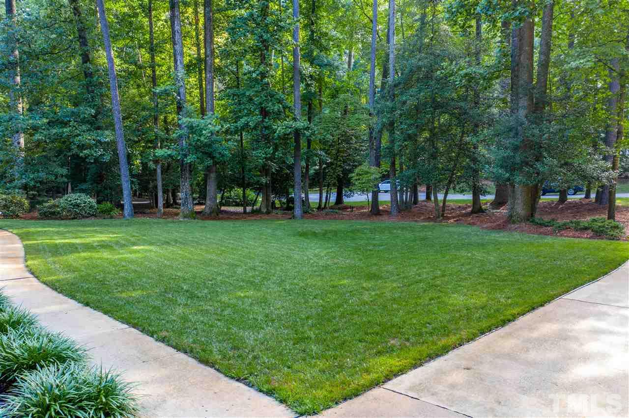 8817 Lomas Court Raleigh, NC 27615 - Photo 5 of 30 a view of a park with large trees