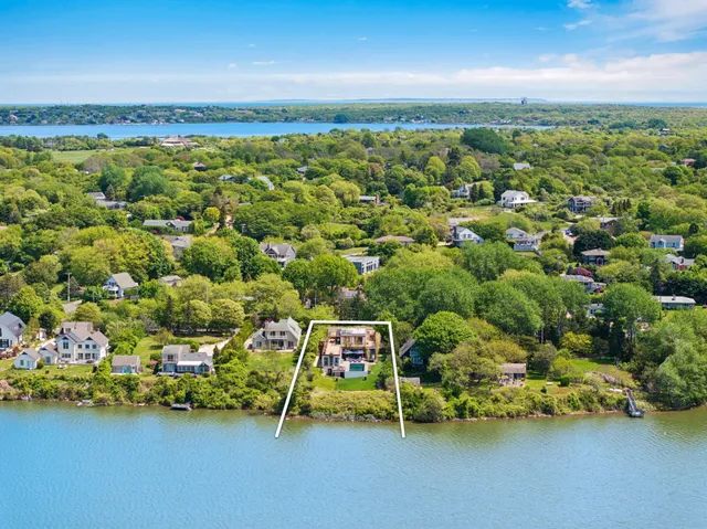 an aerial view of houses with yard