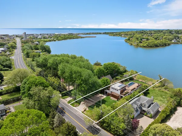 an aerial view of a house with a lake view