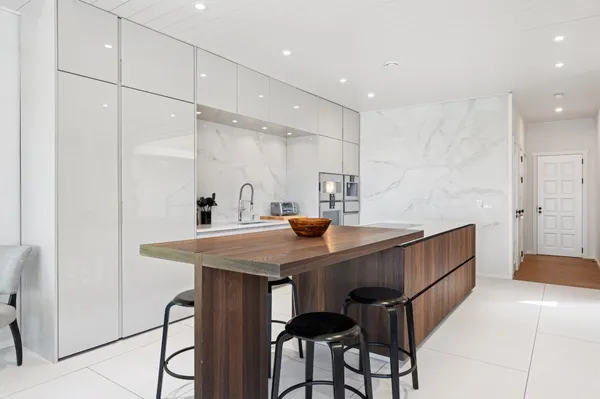 a kitchen with a table and chairs