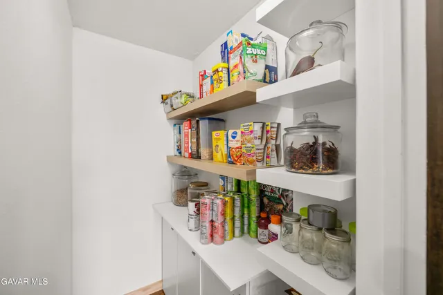 a shelf with books and a book shelf