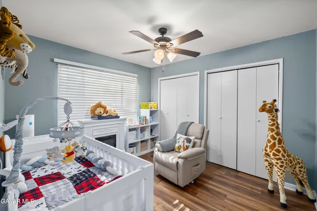 a living room with furniture fireplace and a window