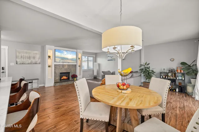 a dining room with furniture a table and chairs