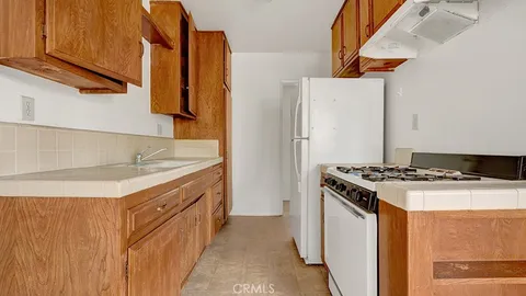a kitchen with a stove and a refrigerator