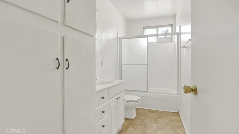 a bathroom with a toilet and shower