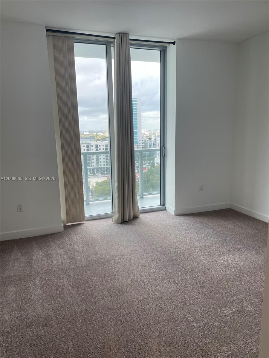 79 Southwest 12th Street, Unit 1601S Miami, FL 33130 - Photo 13 of 18 a view of room with front door