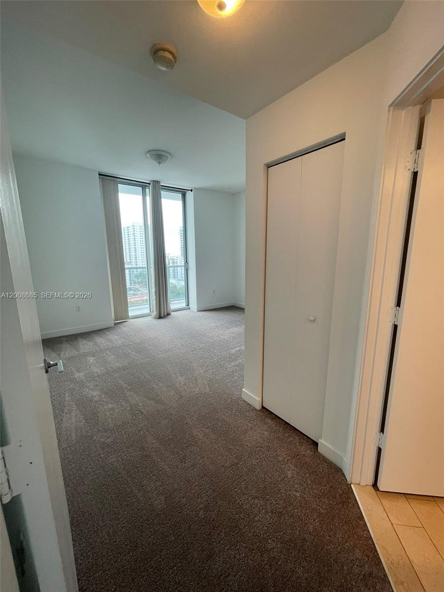 79 Southwest 12th Street, Unit 1601S Miami, FL 33130 - Photo 14 of 18 a view of empty room with windows