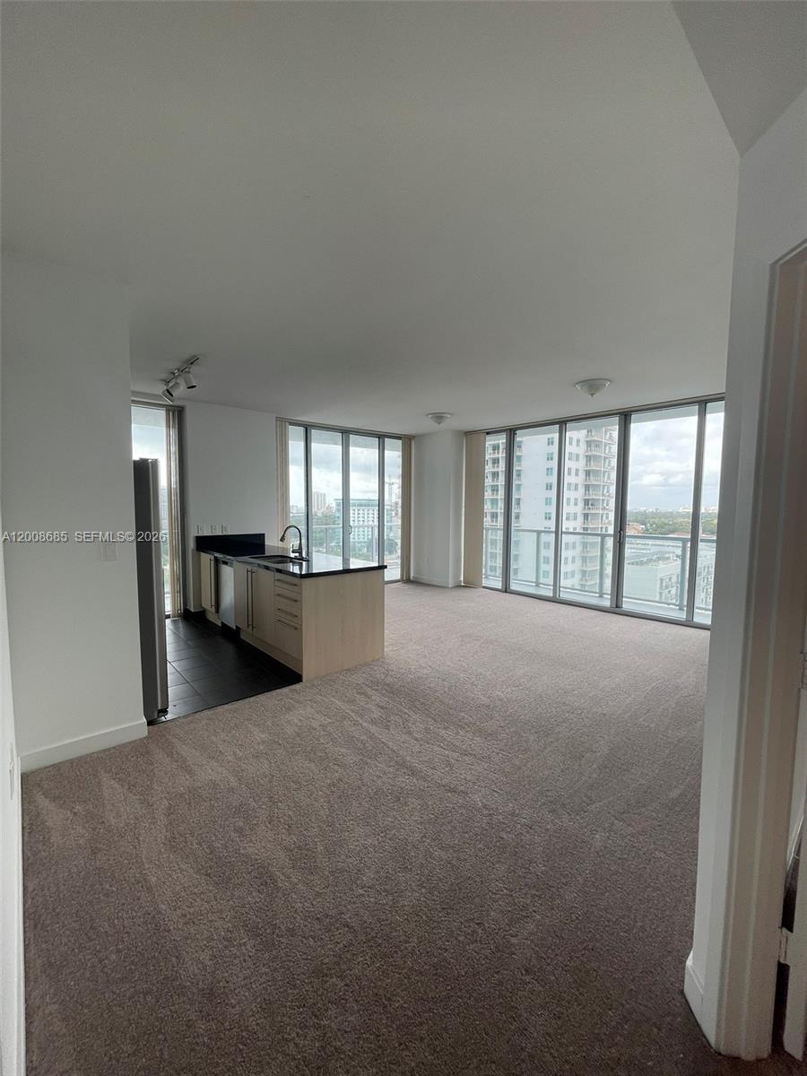 79 Southwest 12th Street, Unit 1601S Miami, FL 33130 - Photo 15 of 18 a view of an empty room with a window