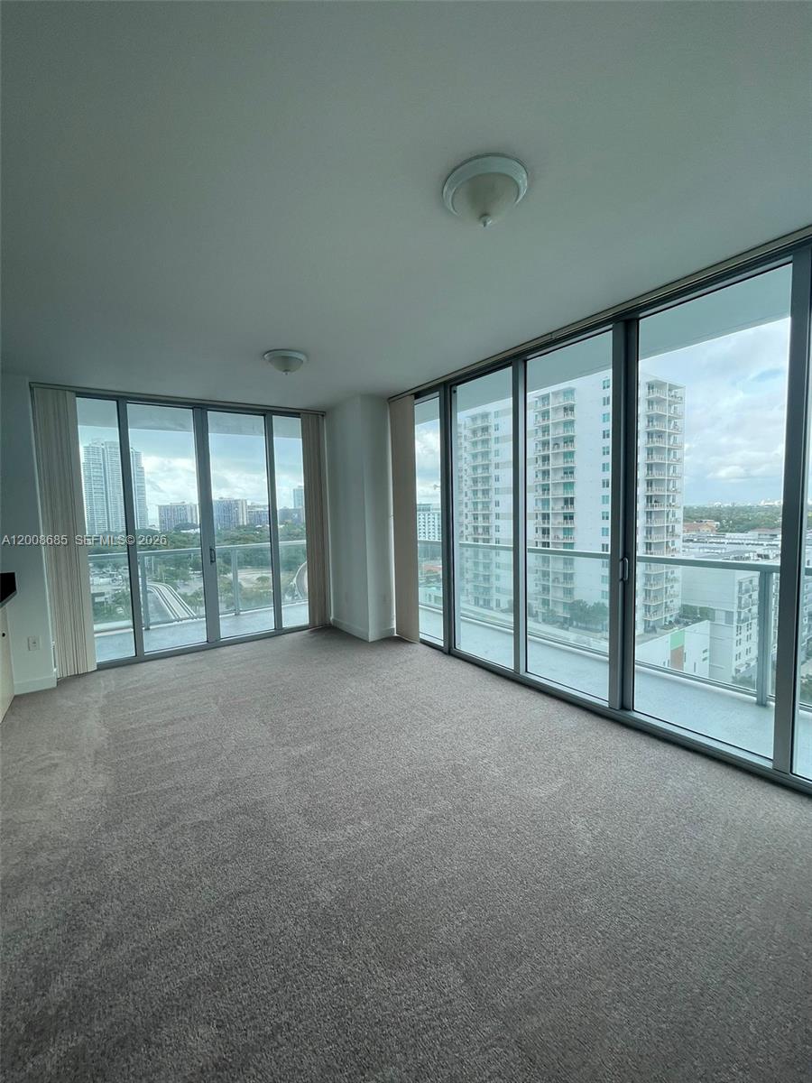 79 Southwest 12th Street, Unit 1601S Miami, FL 33130 - Photo 17 of 18 a view of an empty room with a balcony
