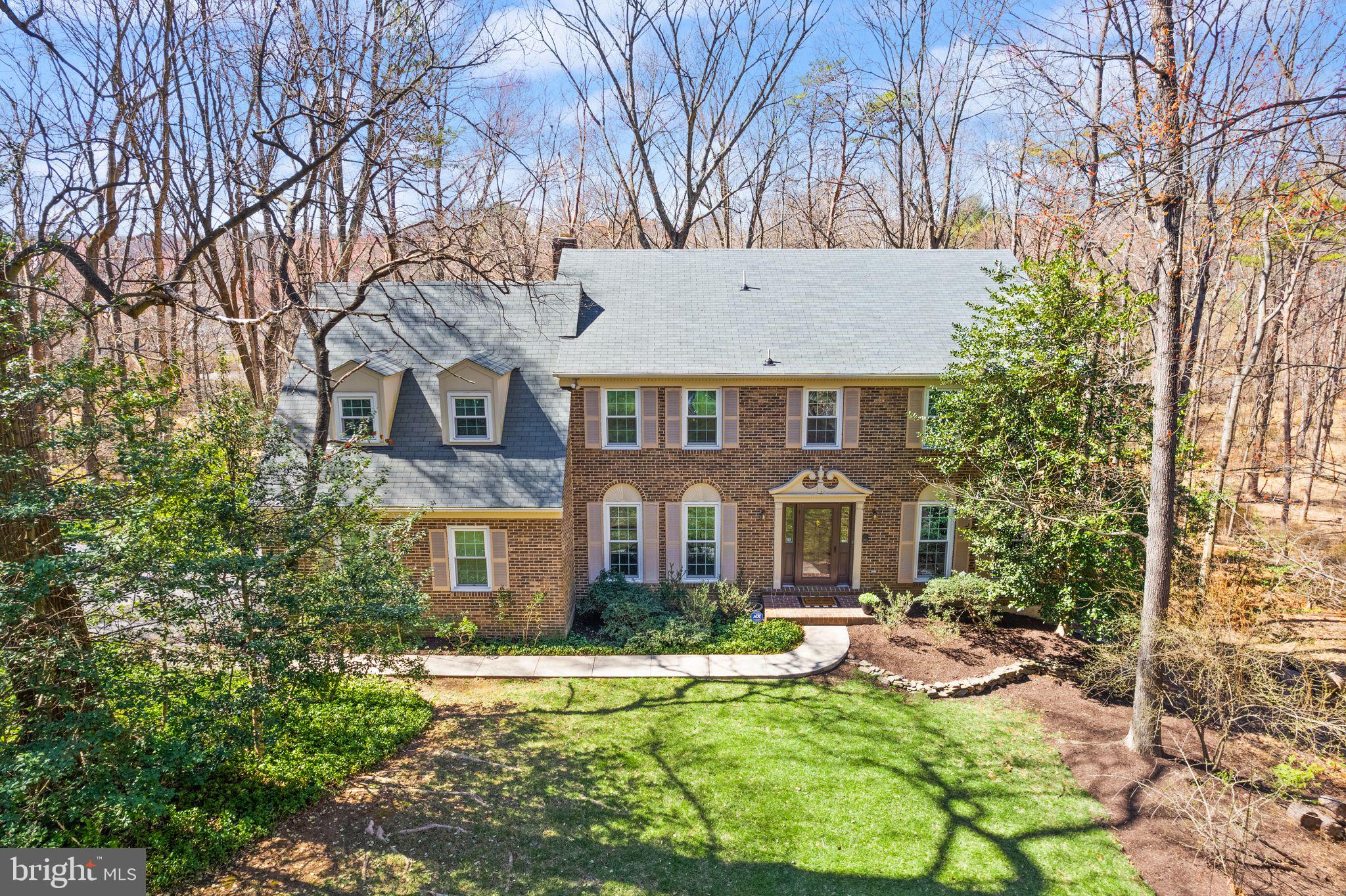 11223 Cranbrook Lane Oakton, VA 22124 - Photo 1 of 42 a front view of a house with yard and green space