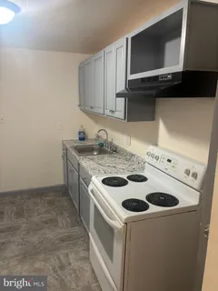 a kitchen with a stove and a microwave