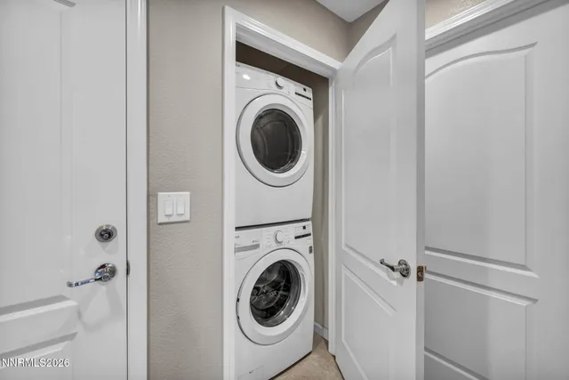 a view of a hallway with washer and dryer