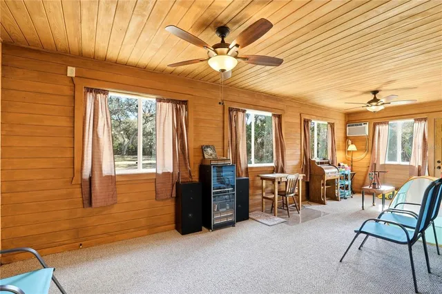 an aerial view of a house with a yard and garden
