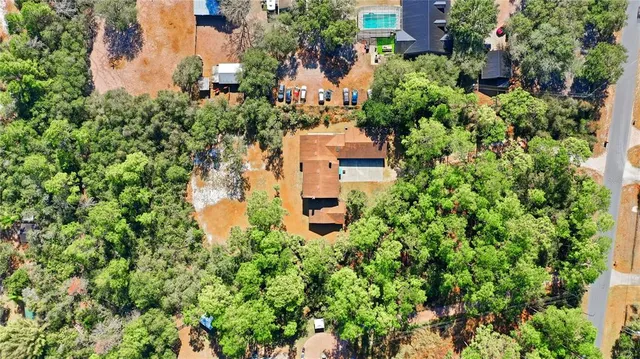 a bathroom with a double vanity sink a toilet and a mirror
