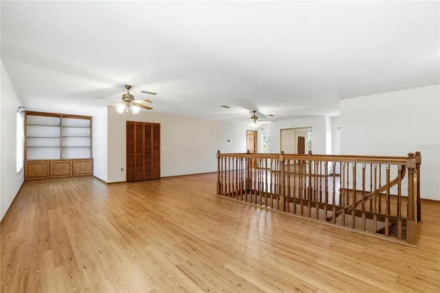 a view of a livingroom with furniture window and wooden floor